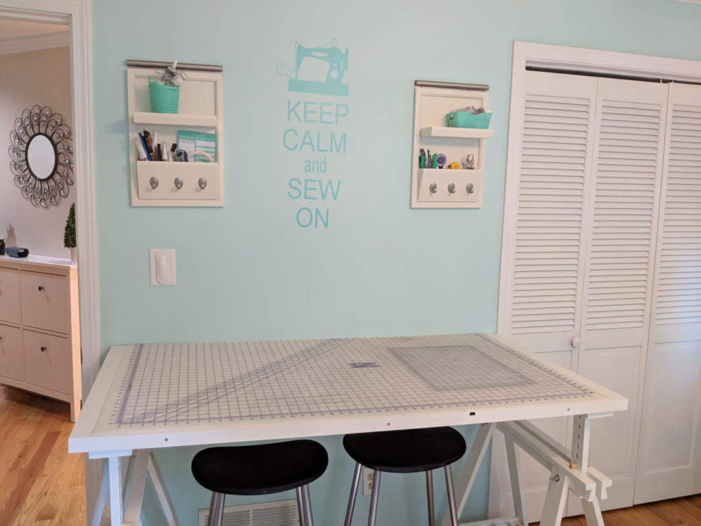 Mint green sewing room with cutting table
